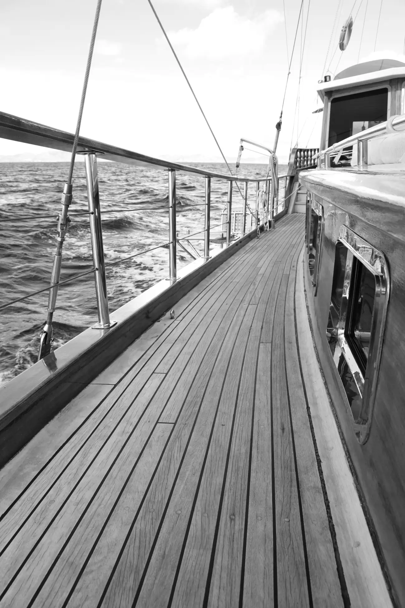 A yacht’s teak side deck at sea